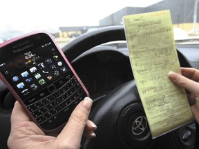 Many Albertans are ignoring the province's distracted driving law.
