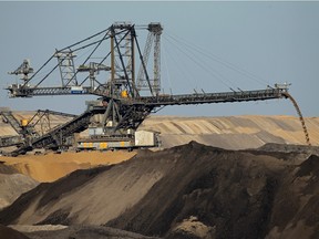 A giant dump truck transports soil at the Welzow open-pit lignite coal mine in August 2010 near Drebkau, Germany.