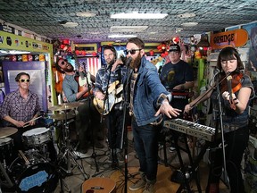 Jeremy Drury, left, Jon Hembrey, Darryl James, Simon Ward, David Ritter and Isabel Ritchie of The Strumbellas perform during the South by Southwest Music Festival on March 19, 2016 in Austin, Texas.