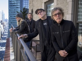 In this April 5, 2016 photo, members of Cheap Trick, from left, Robin Zander, Daxx Nielsen, Rick Nielsen and Tom Petersson pose for a portrait in New York.