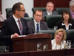 Bob Ascah writes that Alberta's 2016 budget promises to be an important day in Alberta history. In this photo from October 2015, Premier Rachel Notley, right, looks on as Finance Minister Joe Ceci presents the release of the 2015 provincial budget to the Legislative Assembly.