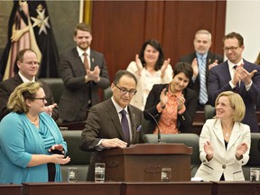 Finance Minister Joe Ceci is applauded as he delivers the 2016 budget in Edmonton on Thursday, April 14, 2016.