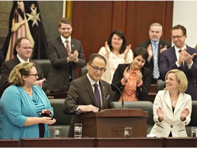 Minister of Finance Joe Ceci is applauded as he delivers the 2016 budget in Edmonton on Thursday April 14, 2016.