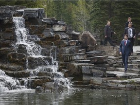 Prime Minister Justin Trudeau, bottom right, walks to meetings at a Liberal Party cabinet retreat in Kananaskis on April 26, 2016.