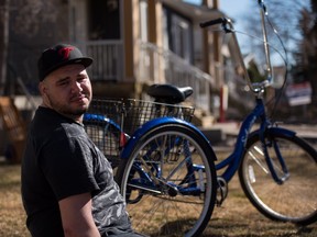 Kris Lawrence, 29, and his specialized blue Schwinn tricycle. His tricycle, which is specially adapted to meet his needs, was stolen on Friday, April 1, 2016 from the side of his house and vandalized.