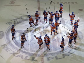 The Edmonton Oilers salute their fans following a 6-2 win over the Vancouver Canucks, during the last NHL game at Rexall Place in Edmonton on April 6, 2016.