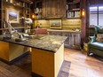 Kevin Gray Interiors, one of the exhibitors at the 2016 Edmonton Cottage Life & Cabin Show, specializes in rustic design, including this miner's cabin-themed office.