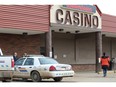 Officers secure the scene of a shooting outside the Boomtown Casino in downtown Fort McMurray. The victim died Wednesday in an Edmonton hospital.