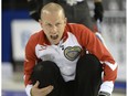 Team Canada skip Pat Simmons yells during a draw against Quebec at the Tim Hortons Brier in Ottawa on Saturday March 5, 2016.