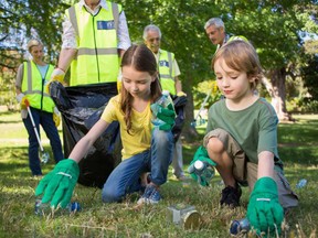 Students help clean up their school ground in Capital City Clean Up’s Schoolyard Clean Up initiative.