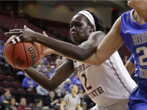 Florida State's Adut Bulgak (2) and Middle Tennessee's Rebecca Reuter (24) reach for a rebound during the first half of a first-round women's college basketball game in the NCAA Tournament Saturday, March 19, 2016, in College Station, Texas.