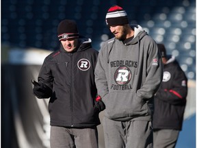Ottawa RedBlacks head coach Rick Campbell, left, and offensive co-ordinator Jason Maas go over the game plan ahead of November's Grey Cup, prior to Maas getting hired as the head coach of the Edmonton Eskimos in December. (File)