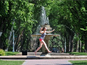 A girl runs around the fountain in the middle of Alexander Circle, located at 133 Street and 103 Avenue in Glenora on April 15, 2016.