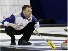 Brad Gushue (skip) watches a rock during game action against Bruce Mouat's team at the Grand Slam of Curling's Humpty's Champions Cup held at the Sherwood Park Arena on April 26, 2016.