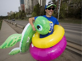 Scott Ward poses for a photo beside Victoria Park Road, in Edmonton on April 28, 2016. A giant slip and slid will be held on Victoria Park Road on July 23.