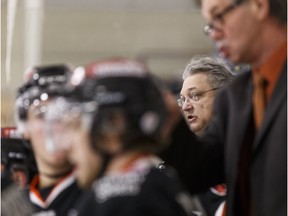 Lloydminster coach and GM Gord Thibodeau directs his players during an AJHL playoff game between the Spruce Grove Saints and the Lloydminster Bobcats at Grant Fuhr Arena in Spruce Grove, Alta., on Friday, April 1, 2016.