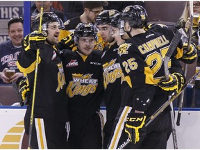 Brandon's Stellio Mattheos (12) celebrates a goal with teammates during the second period of a WHL playoff game between the Edmonton Oil Kings and the Brandon Wheat Kings at Rexall Place in Edmonton, Alta., on Sunday April 3, 2016. Photo by Ian Kucerak