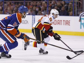 Edmonton's Darnell Nurse chases Calgary's Johnny Gaudreau during NHL action at Rexall Place on April 2, 2016. Gaudreau is one of only a few players who wears the number 13.