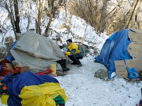 Boyle Street outreach worker Aidan Inglis visits tents set up in the River Valley in 2011. He visits sites like these looking for people that can be helped.