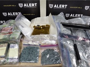 ALERT has arrested three people in Edmonton following a seizure of 1,255 fentanyl pills and other drugs.