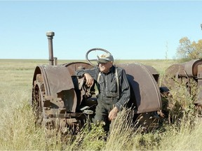 Sitting on one of his family's old lug tractors, Herb Pidt recalls the challenges of farm life in NFB's The Grasslands Project film The Last One.