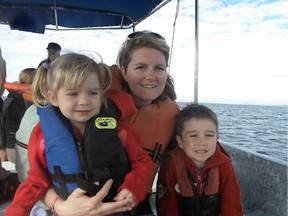 Jolene Cote in 2009 with her children Ayden (right), and Adison (left). Cote was found dead on her Spruce Grove-area property in October 2011. Her family is offering a $50,000 reward for any information that leads to a conviction.