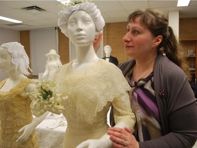 A gown from 1912, with co-curator Julia Petrov,  part of the For Richer or For Poorer: Til Consumption Do Us Part at the University of Alberta.