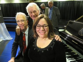 Warmly applauded after the introduction of a Bösendorfer Oscar Peterson Signature Edition Piano for a performance at the Epcor Centre lobby last week were Peterson's widow, Kelly Peterson; Tommy Banks (standing) and Qualico Commercial's host Ken Cantor.
