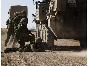 Soldiers of 1 Canadian Mechanized Brigade Group (1 CMBG) take part in Exercise PROMETHEAN RAM which is a live fire training exercise held in Wainwright, Alberta  on April 21, 2016 . Soldiers fire back at attackers to protect the convoy during the exercise.