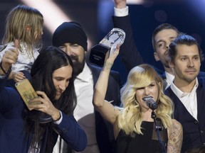 Walk off the Earth celebrate their Juno win for Group of the Year at the Juno Awards in Calgary, Sunday, April 3, 2016.