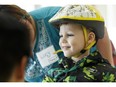 Blake Arsenault, 5, tries out a bike during You Can Ride 2 at Elves Special Needs Society in Edmonton, Alta., on Saturday April 9, 2016. The event helps children with special needs experience the joy of riding a bicycle by getting fitted to specialty bicycles with the assistance of volunteers. (Ian Kucerak photo)