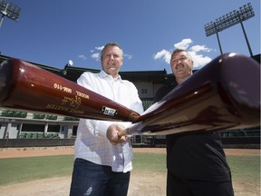 Edmonton Prospects' chief operating officer Craig Tkachuk, left, and Fort McMurray Giants vice-president and general manager Anthony (Dutche) Ianetti pose for a photo at the former Telus Field in Edmonton May 17, 2016. Due to the Fort McMurray wildfires, the Giants will be playing out of the Edmonton stadium for at least the first half of the 2016 WMBL season.