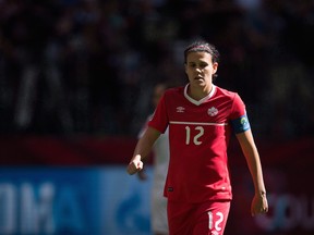 Canada's Christine Sinclair looks on during first half of the FIFA Women's World Cup round of 16 soccer action in Vancouver on June 21, 2015. Christine Sinclair leads a squad infused with youth for a pair of women's soccer friendlies against Brazil as Canada gears up for the Rio Olympics in August. The Canadian captain is one of five players over 30 on the 20-woman squad, which looks to be the template coach John Herdman will work on in choosing his Olympic roster. The others are defenders Rhian Wilkinson and Josee Belanger, midfielder Diana Matheson, and forward Melissa Tancredi. THE CANADIAN PRESS/Darryl Dyck