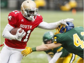 South's Ted Kubongo (left) pushes away North's Isiah Brown during the second half of the 2016 Football Alberta Senior Bowl at Commonwealth Stadium in Edmonton, Alta., on Monday May 23, 2016. Photo by Ian Kucerak