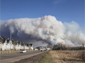 A forest fire burns as viewed from Highway 69 south of Fort McMurray Alta. on Sunday May 1, 2016. (Robert Murray photo)
