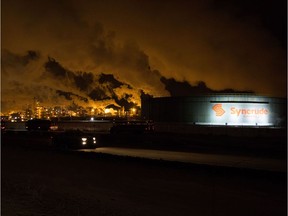 Oilsands companies such as Syncrude and Suncor are continuing to pay staff forced off the job by the Fort McMurray wildfires, but thousands of tradespeople working for contractors aren't so lucky.