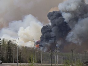 Smoke rises from a wildfire outside Fort McMurray,