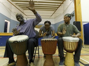 (Left to right) Muru Hamisi, Pauline Wagereka and Sangea Academy's Joel Cuesta play drums during the African Canadians for Fort Mac Block Party held at the Africa Centre in Edmonton, Alta., on Saturday May 14, 2016. The Africa Centre is hosting an Africa Day gala Saturday that will showcase African countries' culture.