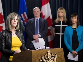 Minister of Service Alberta, Stephanie McLean, provides details about Bill 15 called "An Act to End Predatory Lending" on May, 12 2016. She was joined on the podium by: Garth Warner, president and CEO of Servus Credit Union; Shelley Vandenberg, president of First Financial; and Courtney Hare, public policy manager of Momentum.
