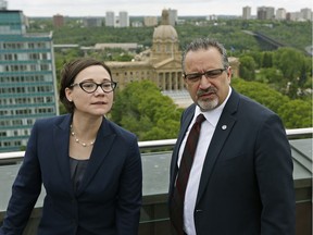 Environment Minister Shannon Phillips (left) and Alberta Teachers Association president Mark Ramsankar on the roof of the Federal Building in Edmonton on May 24, 2016, where Phillips introduced Bill 20, the Climate Leadership Implementation Act.