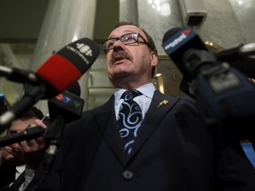 Progressive Conservative leader Ric McIver speaks to the media after the NDP delivered the 2016/2017 provincial budget at the Alberta Legislature, in Edmonton Alta. on Thursday April 14, 2016.