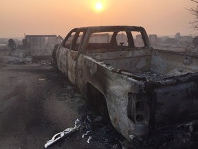 A burned-out truck in the Beacon Hill area of Fort McMurray, Alta., is shown on May 4, 2016.