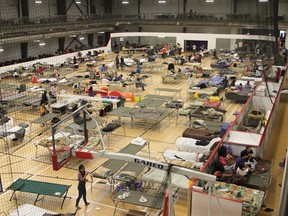 Cots are set up in the fieldhouse of the Anzac Recreation Centre in Anzac Alta. on Wednesday May 4, 2016.