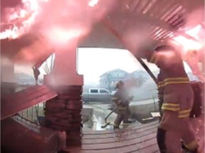 Doorbell camera captures dramatic attempt by firefighters to save a house in Fort McMurray.  Supplied