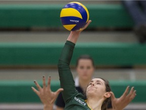 EDMONTON, AB. FEBRUARY 20, 2015 - Meg Casault  of the University of Alberta Pandas, smashes the ball at Nikki Cornwall of the Trinity Western University Spartans at the Saville Centre in Edmonton in the Womens' final match of the Canada West final four Championships. Shaughn Butts/Edmonton Journal