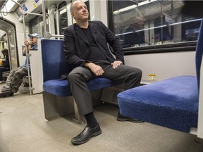 Columnist David Staples on the LRT demonstrates manspreading.