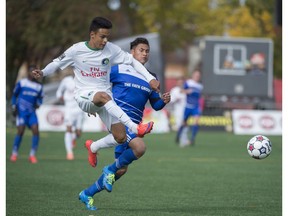 FC Edmonton's Dustin Corea chases David Diosa of the New York Cosmos at Clarke Stadium in Edmonton during a previous visit. (File)