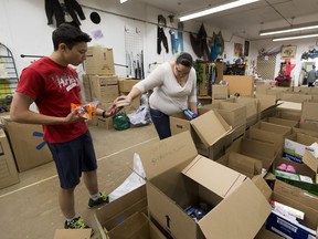 Volunteers at the Edmonton Emergency Relief Services Society (EERSS) package supplies used to support Fort McMurray evacuees, on May, 12 2016 n Edmonton.