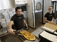 Pizza chef Marko Grover (left) and owner Braede Harris (right) prepare a pizza at LovePizza.