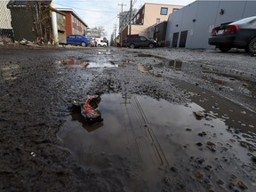 A pothole filled alley in Old Strathcona in 2015.